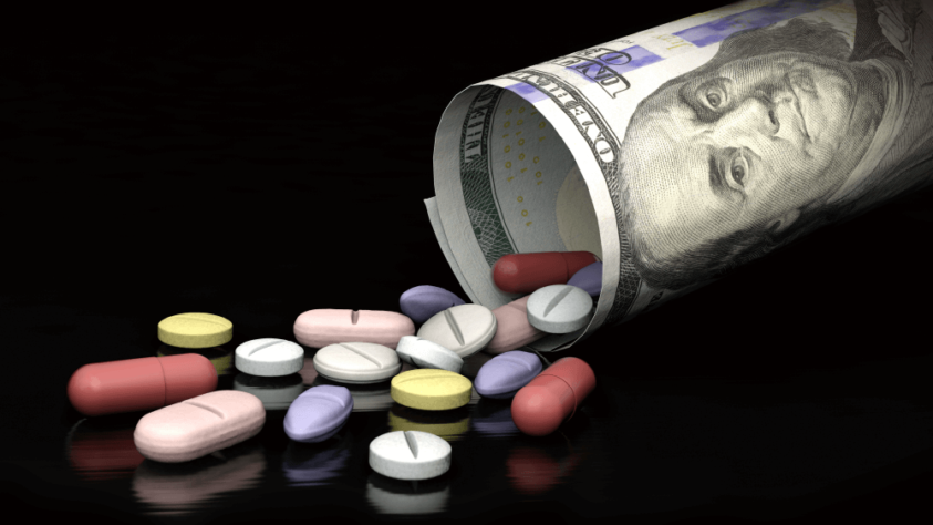 medicine pills flowing out of a dollar bill