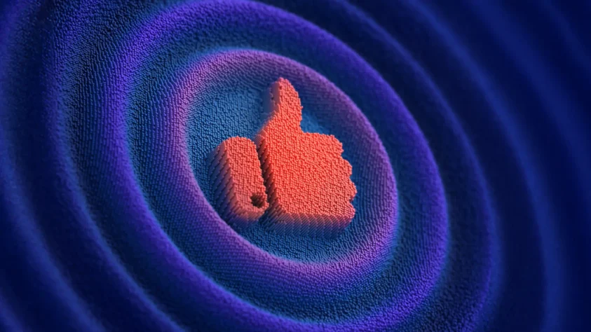 A red thumbs up surrounded by blue and purple circular ripples