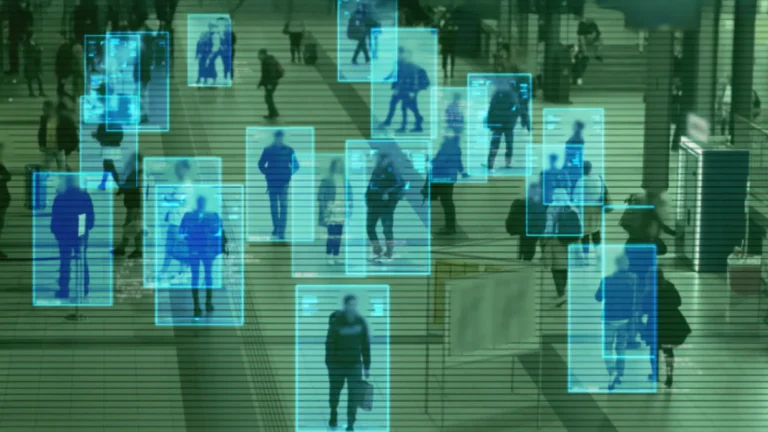 People walking around on security camera footgae, with blue boxes surrounding each person