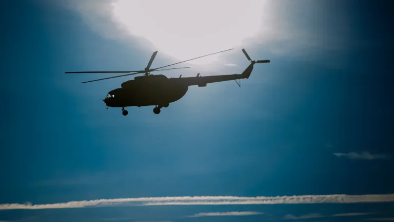 Military helicopter flying through the air