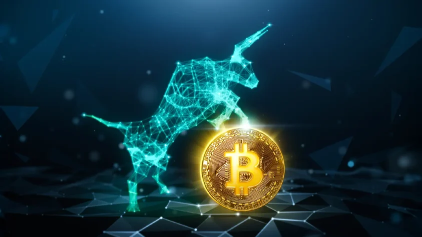 Digital bull with its front two legs riding on a Bitcoin